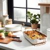 b2.75qt Oven-to-Table Stoneware Oval Baking Dish with Cradle Carrier Cream/Clay